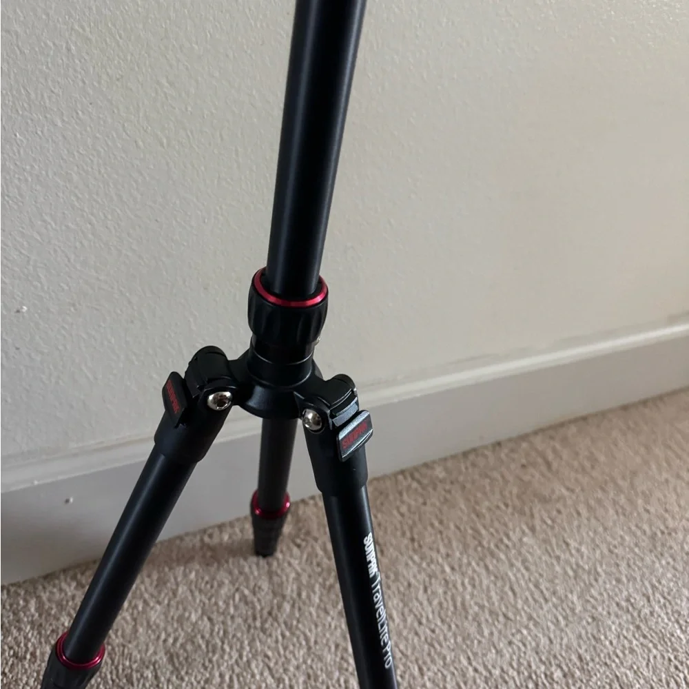 Compact Black Tripod with Red Accents